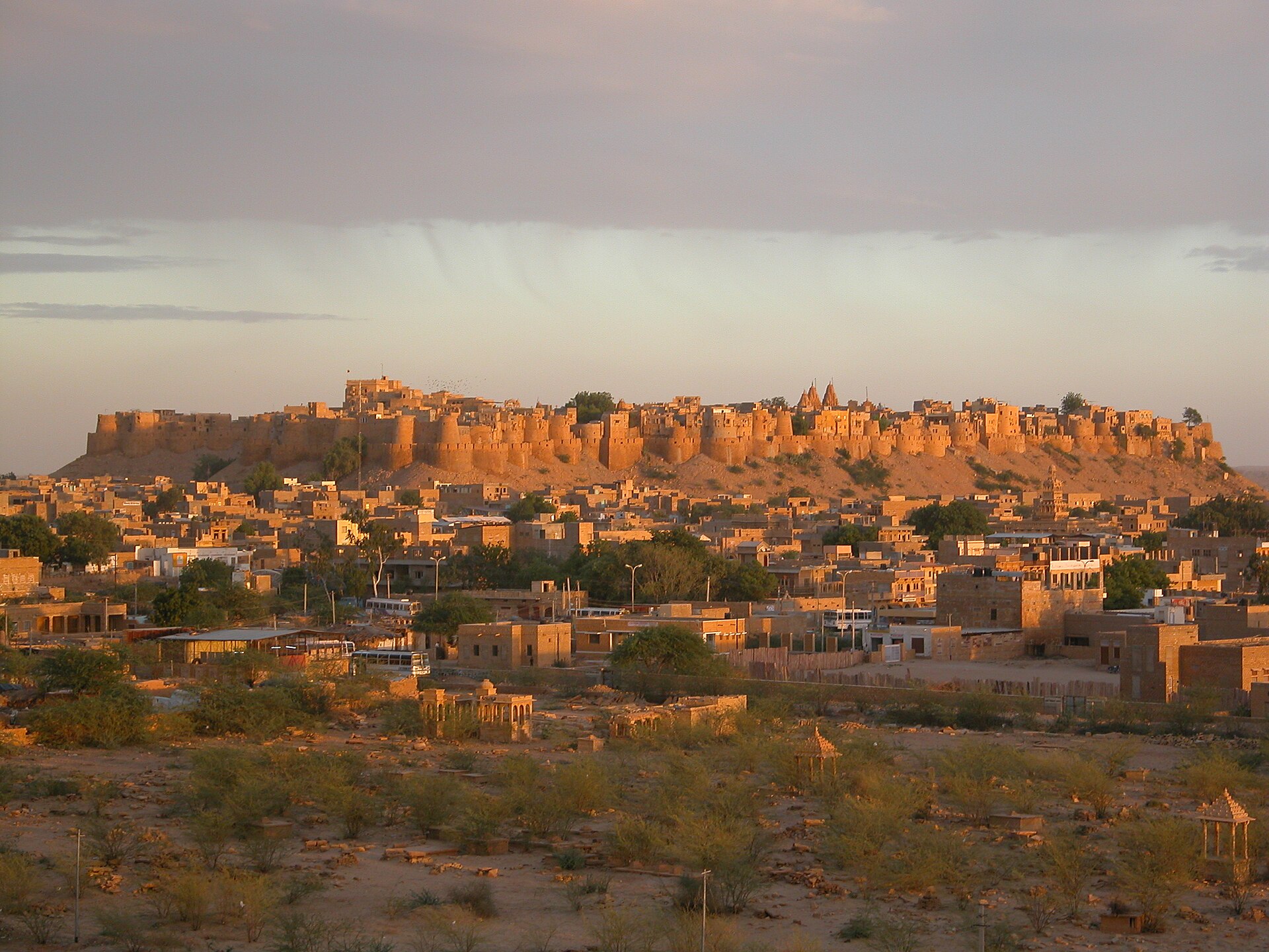 Jaisalmer Fort glowing above the desert city at sunset